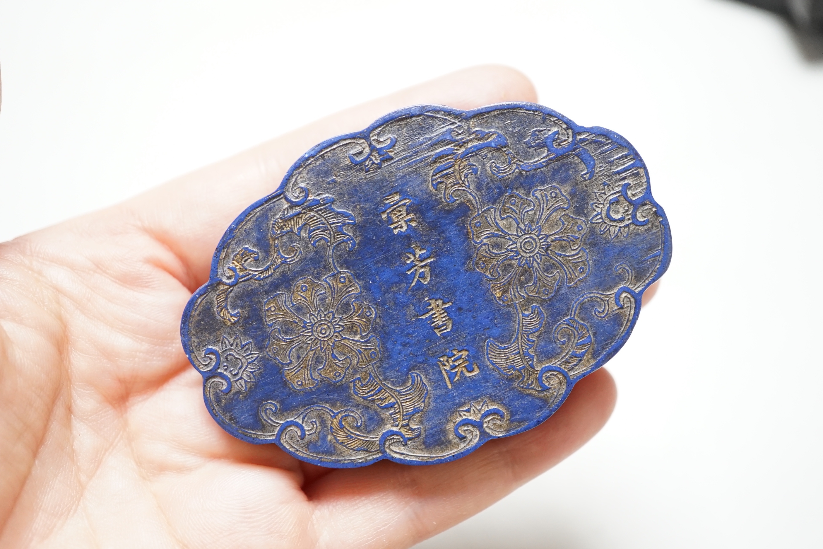 A Chinese ink block in a fitted wood box, 9.5 cm